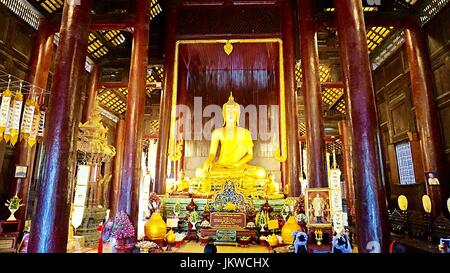 Golden Buddha image statue in Thai temple in Chiang Mai, Thailand. Stock Photo