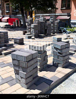 Laying of paving slabs on the construction site for the street pavement of the city Stock Photo