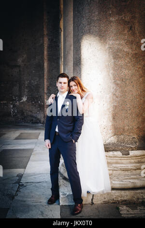 bride and groom posing on the streets Stock Photo - Alamy