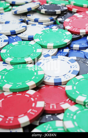 Casino poker money chips texture. Stack of poker chips as background. Stock Photo