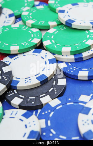 Casino poker money chips texture. Stack of poker chips as background. Stock Photo