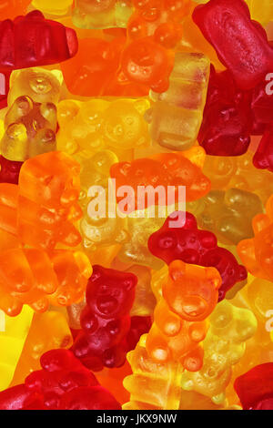 Gummy bear candy closeup texture pattern backgrounbd photo. Stock Photo