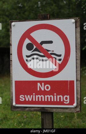 No swimming sign UK red and white Stock Photo