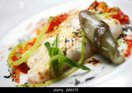 Conger with vegetables and spicy sauce. Stock Photo