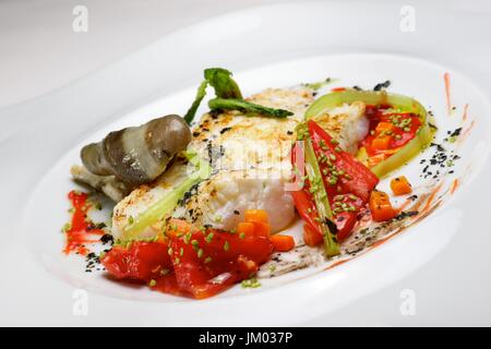 Conger with vegetables and spicy sauce. Stock Photo