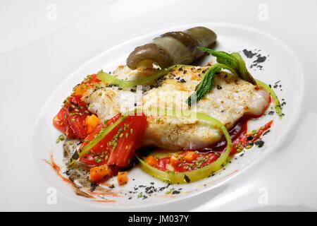 Conger with vegetables and spicy sauce. Stock Photo