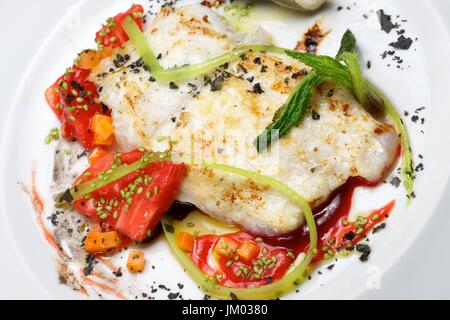 Conger with vegetables and spicy sauce. Stock Photo