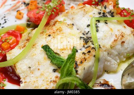 Conger with vegetables and spicy sauce. Stock Photo