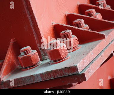 Heavy duty bolts and nuts hold a girder in place Stock Photo