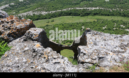Caves in the cave town Tepe Kermen in Crimea. Stock Photo