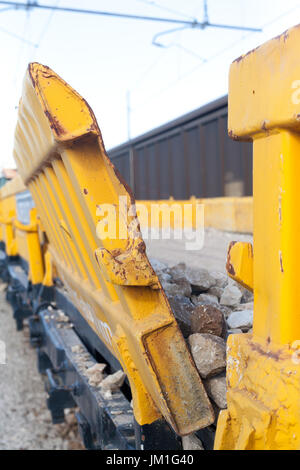 Stone transport freight train wagon in railway depot Stock Photo