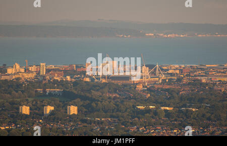 Overview of the city of Cardiff including the Principality Stadium at sunset, with the Bristol Channel and Somersetshire in the background. Stock Photo