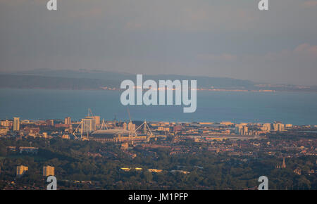 Overview of the city of Cardiff including the Principality Stadium at sunset, with the Bristol Channel and Somersetshire in the background. Stock Photo