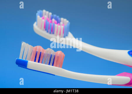 Two Toothbrush Heads on Blue Background Stock Photo