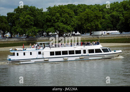 London, UK. 25th July, 2017. A Thames cruise boat with police escort. Low tide on the Thames. Credit: JOHNNY ARMSTEAD/Alamy Live News Stock Photo