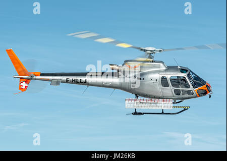 Flight service of Courcevel altiport in a blue sky Stock Photo