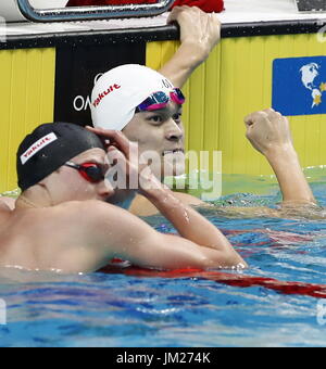 Budapest. 25th July, 2017. China's Sun Yang (top) celebrates after the men's 200m freestyle swimming event at the 17th FINA World Championships in Budapest, Hungary on July 25, 2017. Sun Yang won the gold with 1:44.39. Credit: Ding Xu/Xinhua/Alamy Live News Stock Photo