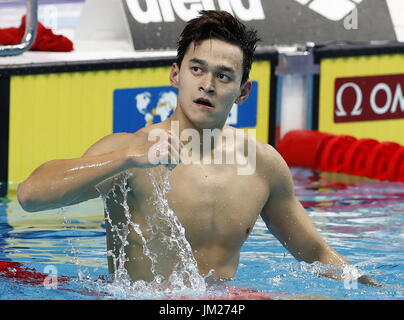 Budapest. 25th July, 2017. China's Sun Yang celebrates after the men's 200m freestyle swimming event at the 17th FINA World Championships in Budapest, Hungary on July 25, 2017. Sun Yang won the gold with 1:44.39. Credit: Ding Xu/Xinhua/Alamy Live News Stock Photo