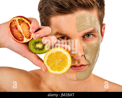 Facial man mask from fruits and clay. Face mud applied. Stock Photo