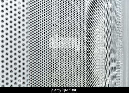 Gray metal background, round perforated metal texture Stock Photo
