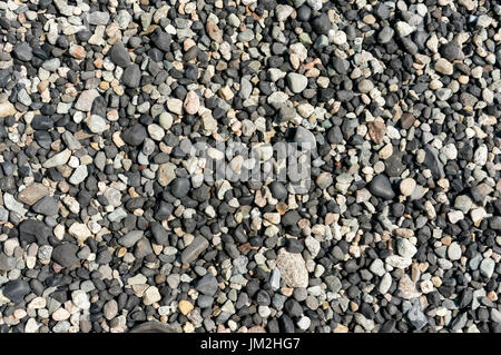 Close-up of multicolored rounded beach pebbles on a rocky beach on Bowen Island, British Columbia, Canada Stock Photo