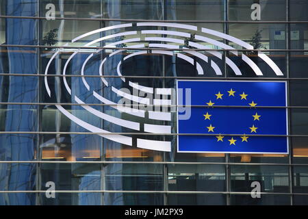 Brussels, Belgium - July 17, 2017: Emblem of the European Parliament close-up. Glass facade of the building of the European Parliament in Brussels. Stock Photo
