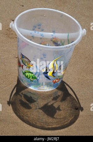 Child's Bucket in the sun with shadows. Stock Photo