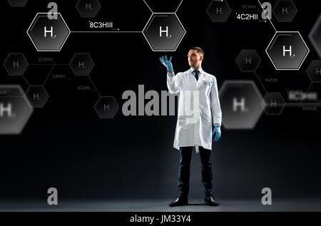 scientist with virtual chemical formula projection Stock Photo