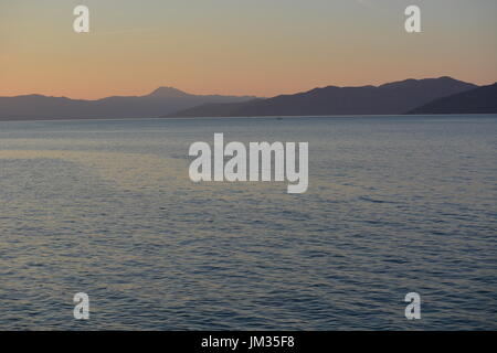 Cres, Croatia - June 18, 2017 - Island cres with ocean during sunset near Valun Stock Photo