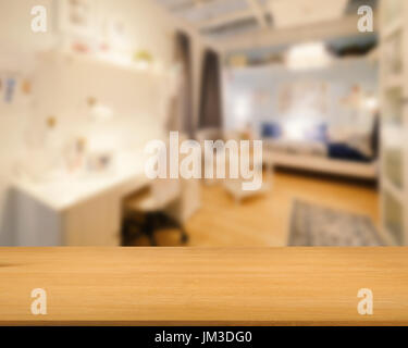 wooden counter with bedroom blurred background Stock Photo