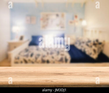wooden counter with bedroom blurred background Stock Photo
