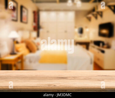 wooden counter with bedroom blurred background Stock Photo