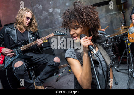 young rock band rehearsing in musical studio, hard rock music concept Stock Photo