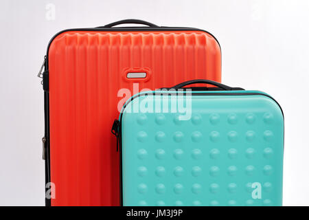 Cropped image of modern suitcases. Business travel bags close up. Stock Photo