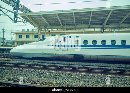 KYOTO, JAPAN - JULY 05, 2017: JR700 shinkansen bullet train departing Kyoto station in Kyoto, Japan Stock Photo