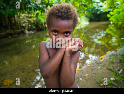 Portrait of a shy Ni-Vanuatu blonde hair girl, Efate island, Port Vila, Vanuatu Stock Photo