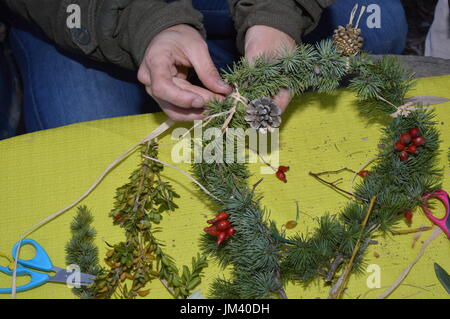 Building Christmas wreaths Stock Photo