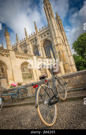 A student's bicycle locked up on the cobbled street outside King's College Chapel in Cambridge, Cambridgeshire, UK Stock Photo