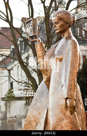 Warsaw, Poland - December 2, 2014: Sculpture of Marie Sklodowska-Curie by polish sculptor Bronislaw Krzysztof. The Nobel prize winning scientist is ho Stock Photo