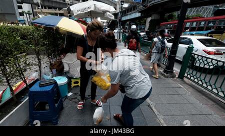 The Erawan Shrine Area Tourist Attraction Bangkok Thailand is the center most point of the city Stock Photo