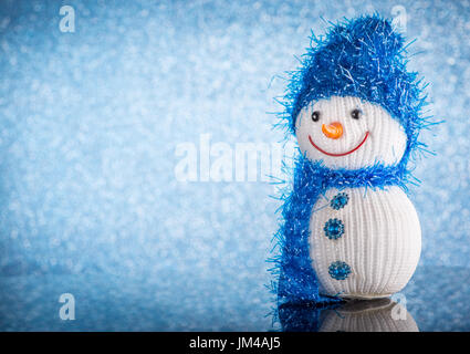 Snowman on a blue Christmas background Stock Photo