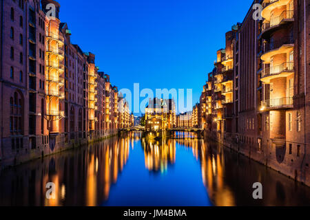 Canal Warehouses in Downtown District of Hamburg Germany at dusk Stock Photo
