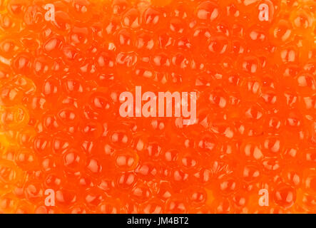 Background pattern of salmon fish red caviar close up, elevated top view, directly above Stock Photo