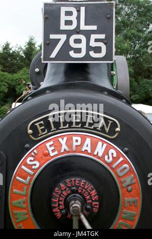 Circular orange nameplate and number plate on traction engine at Masham Steam Fair, Masham, North Yorkshire, UK Stock Photo