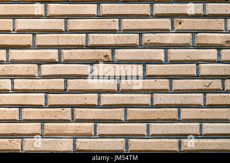background from outdoor yellow brown brick wall Stock Photo