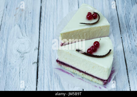 Two white cheesecakes on a white background. Dessert menu. Stock Photo