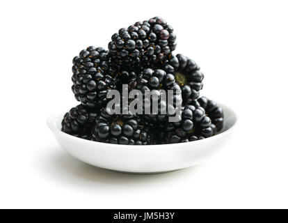 Tasty ripe blackberries in bowl isolated on white background. Stock Photo