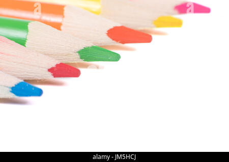 Colored pencils isolated on white background arranged in diagonal, close-up on sharpened tips Stock Photo