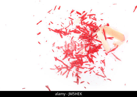 Pile of shavings after sharpening red pencil viewed from above, isolated on white background Stock Photo