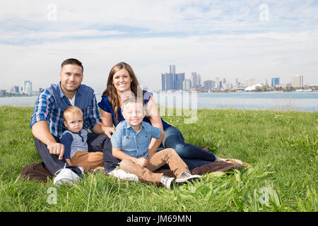 A family at the park in the city Stock Photo
